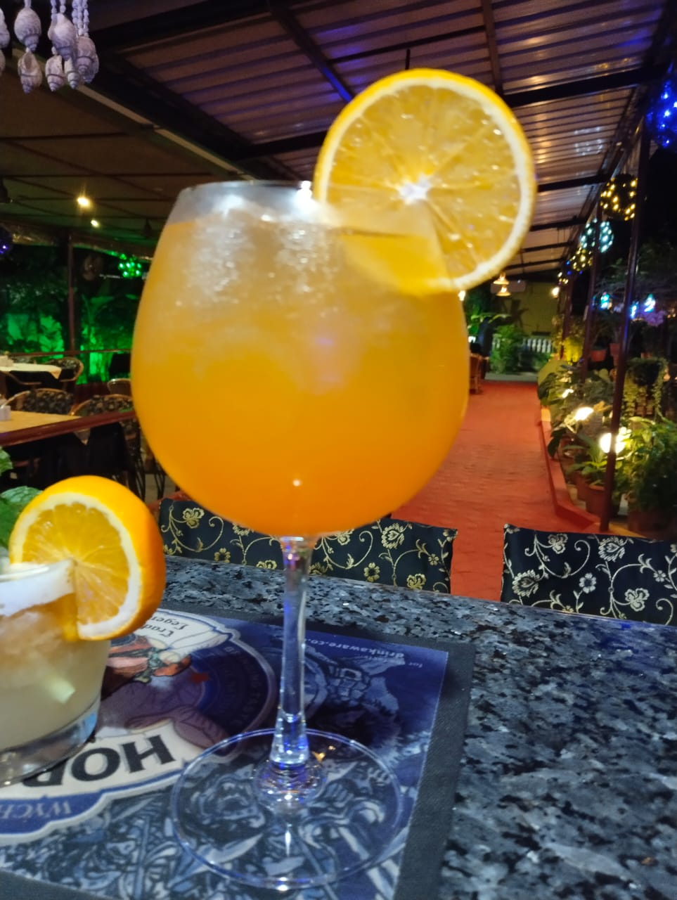 Customer enjoying premium beverages at Octima Restaurant